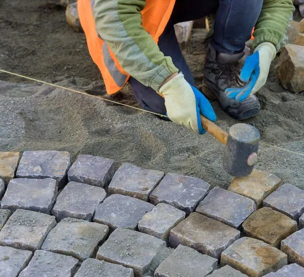 Captivating natural stone paving, blending earthy textures and hues in a harmonious outdoor design.